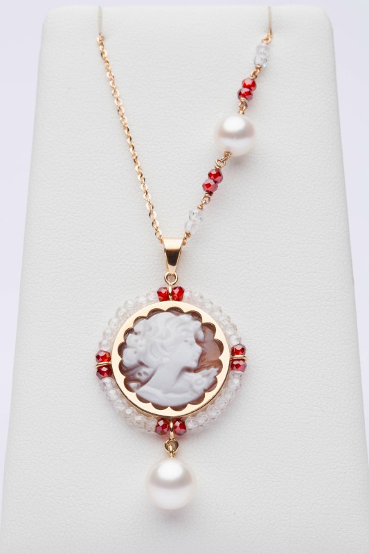 Red and white charm with cameo