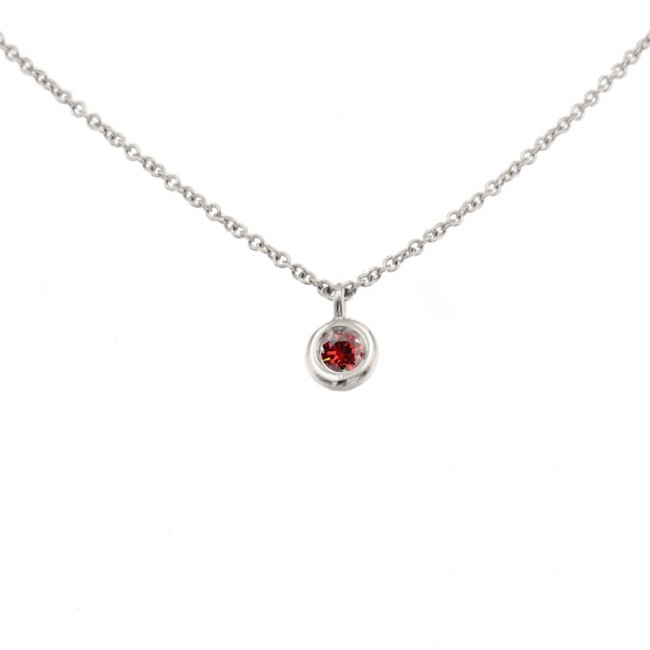 White gold charm with red diamond