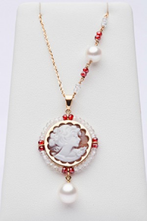 Red and white charm with cameo